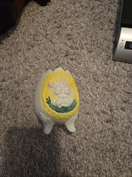 3 Footed, Bisque, Egg Shaped Vase With 3D Bunnies On Front
